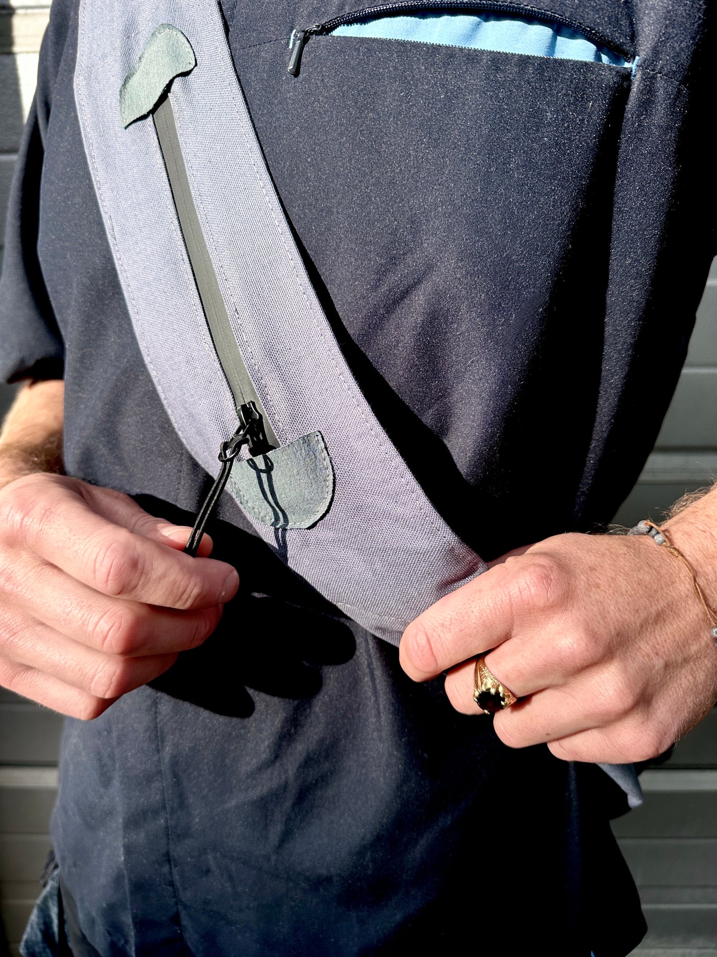 *Aspire treated canvas steel blue sling bag